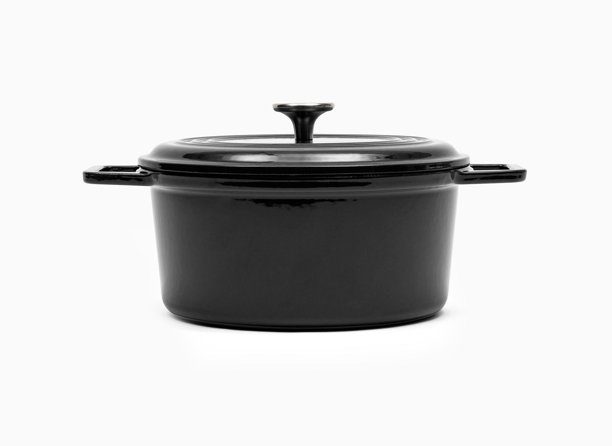 Black Misen Dutch Oven covered by Traditional Lid with knob handle.