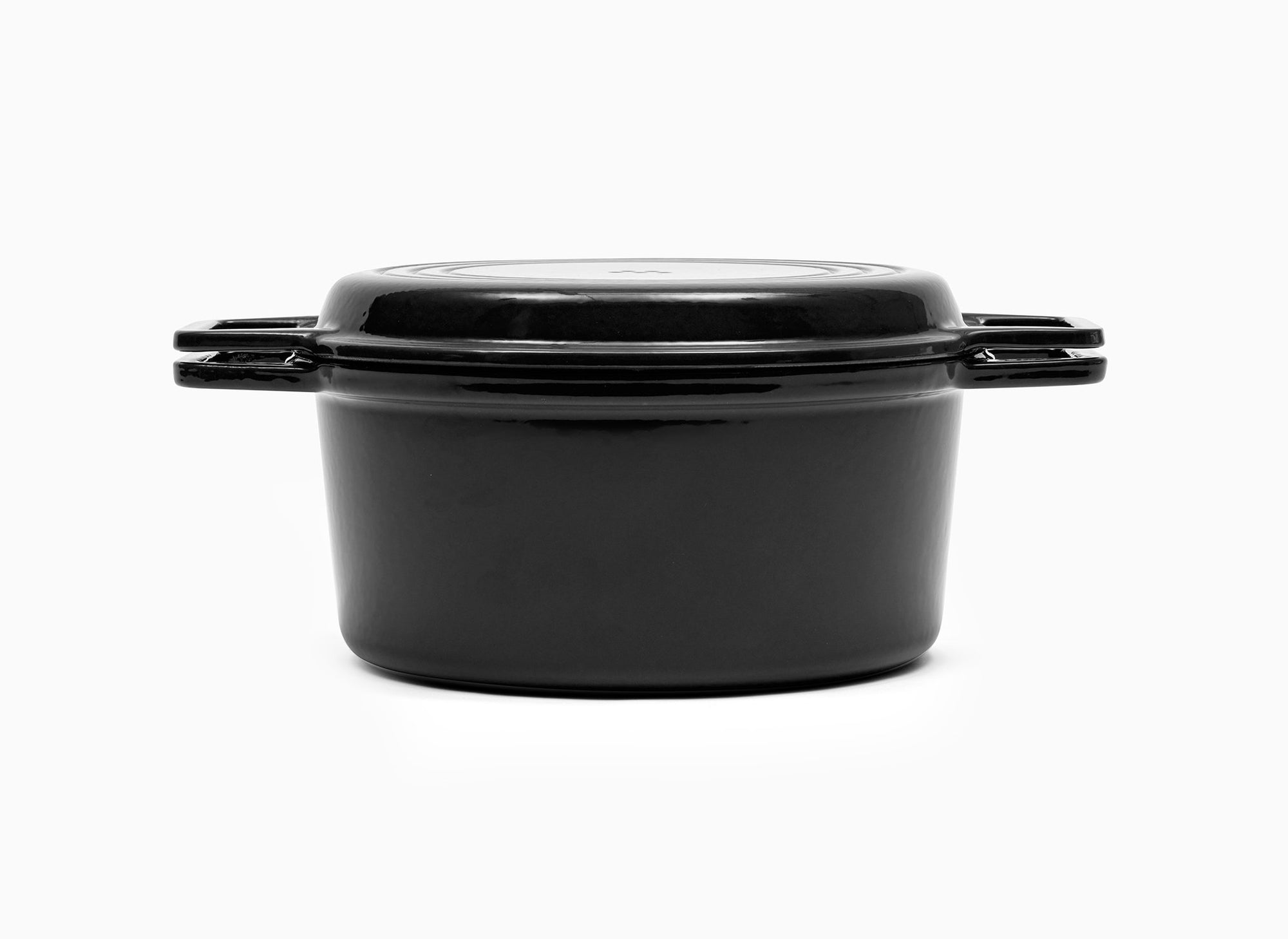 Black Misen Dutch Oven covered by Grill Lid.