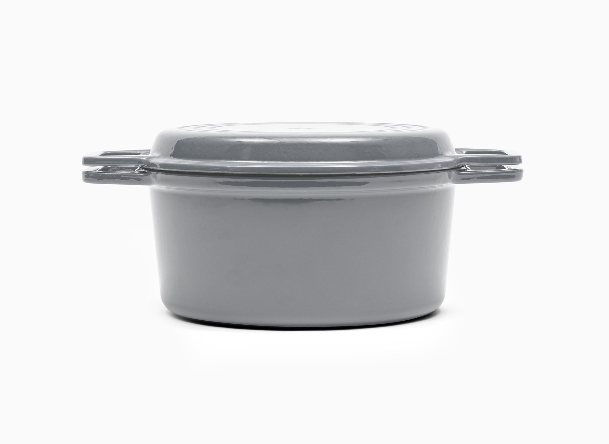 Gray Misen Dutch Oven covered by Grill Lid.