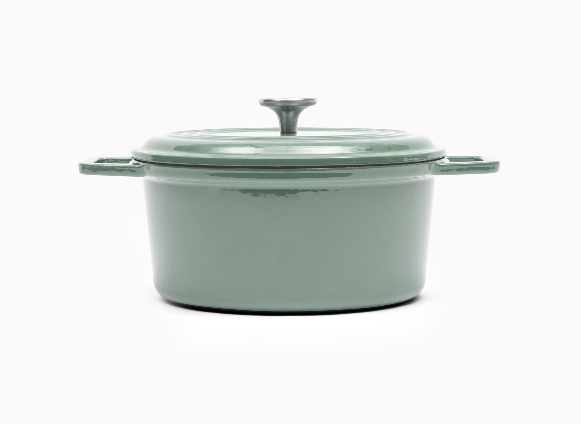 Green Misen Dutch Oven covered by Traditional Lid with knob handle.