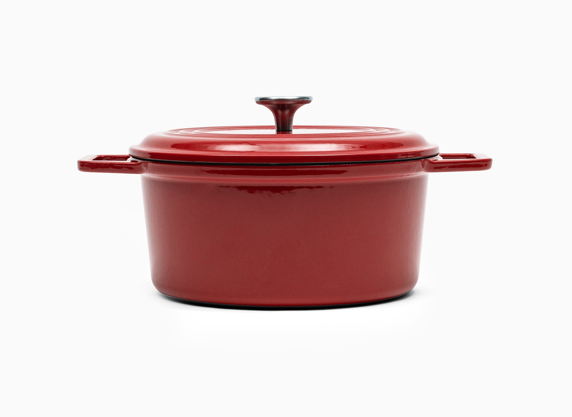 Red Misen Dutch Oven covered by Traditional Lid with knob handle.
