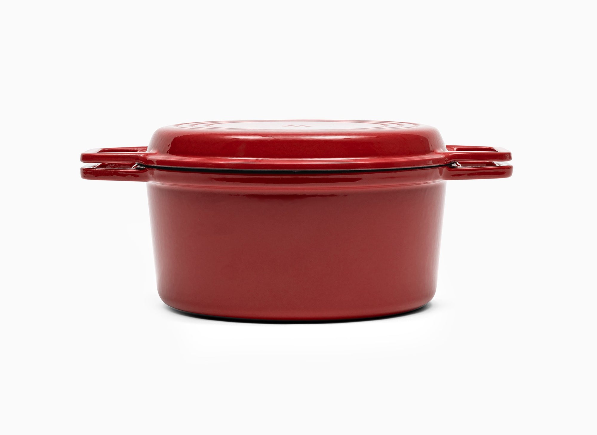 Red Misen Dutch Oven covered by Grill Lid.