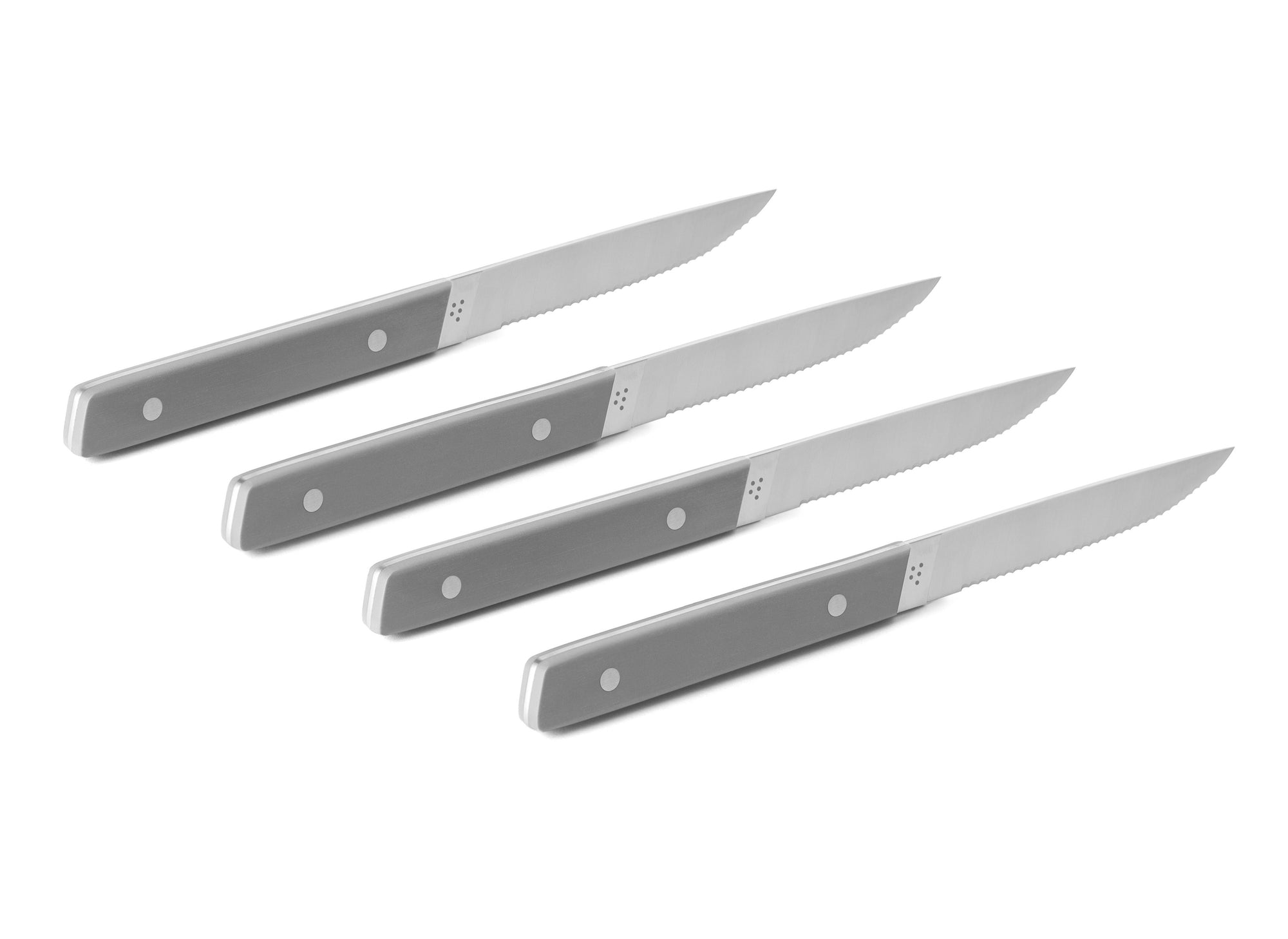 {{4pc-gray}} The 4-Piece Misen Steak Knives in gray are slim and comfortable to hold with a full tang handle.