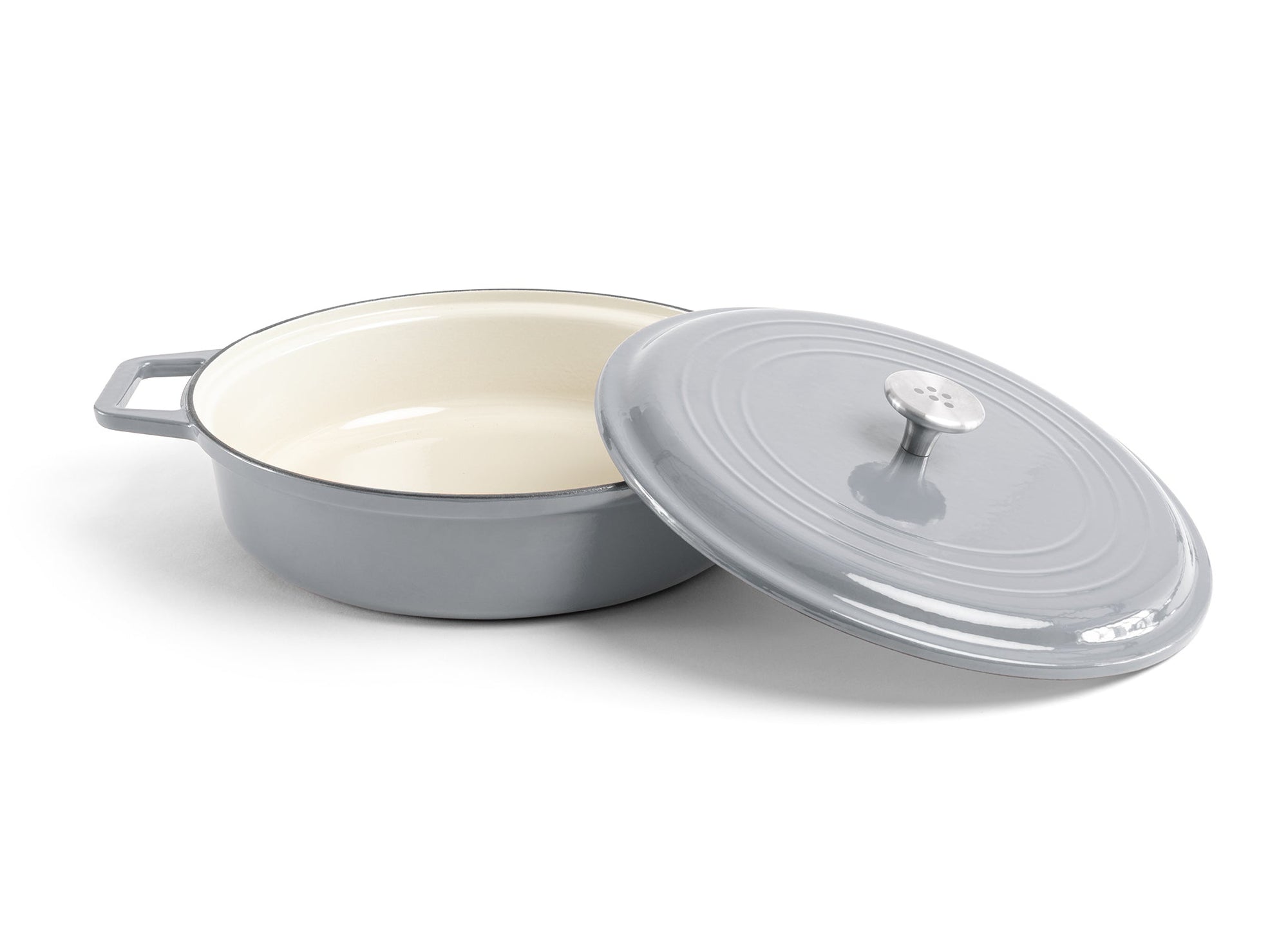 {{gray}} A grey Misen Enameled Cast Iron Braiser with knob-handle lid removed and resting against the pan’s side.