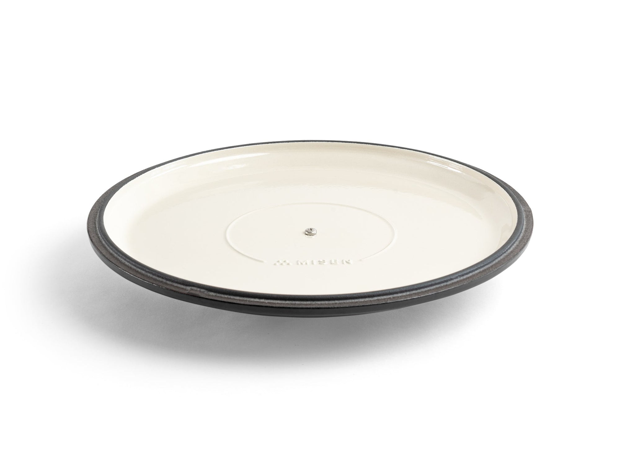 {{black}} An upside-down black Misen Enameled Cast Iron Braiser lid, with the Misen logo visible on its cream-white interior.