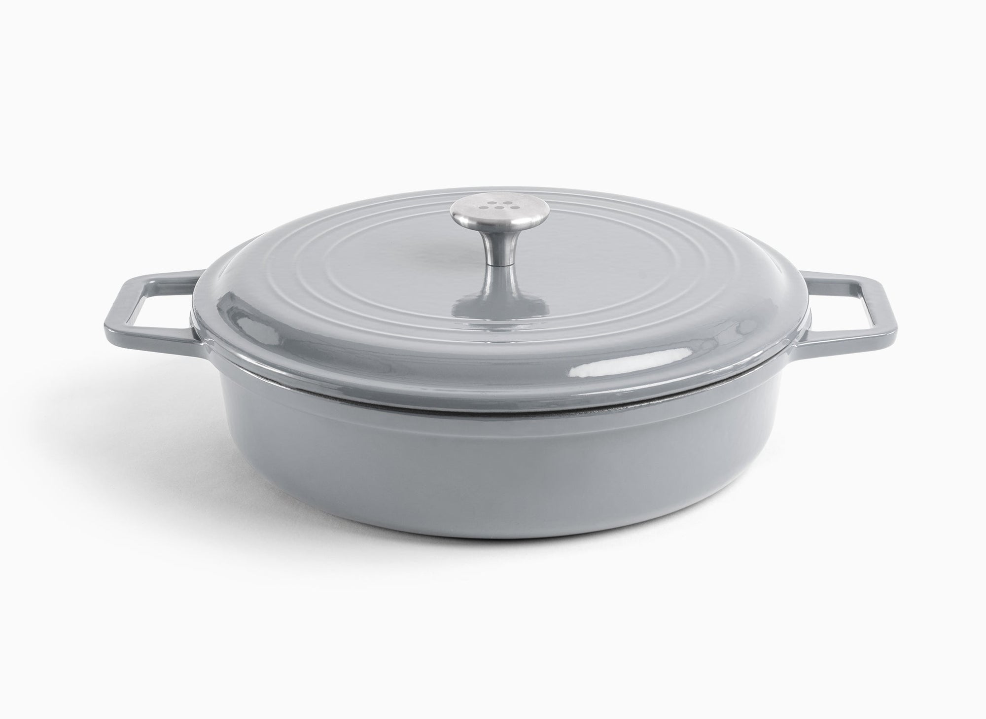 A grey Misen Enameled Cast Iron Braiser with knob-handle lid. Misen logo is visible on the lid’s central handle.