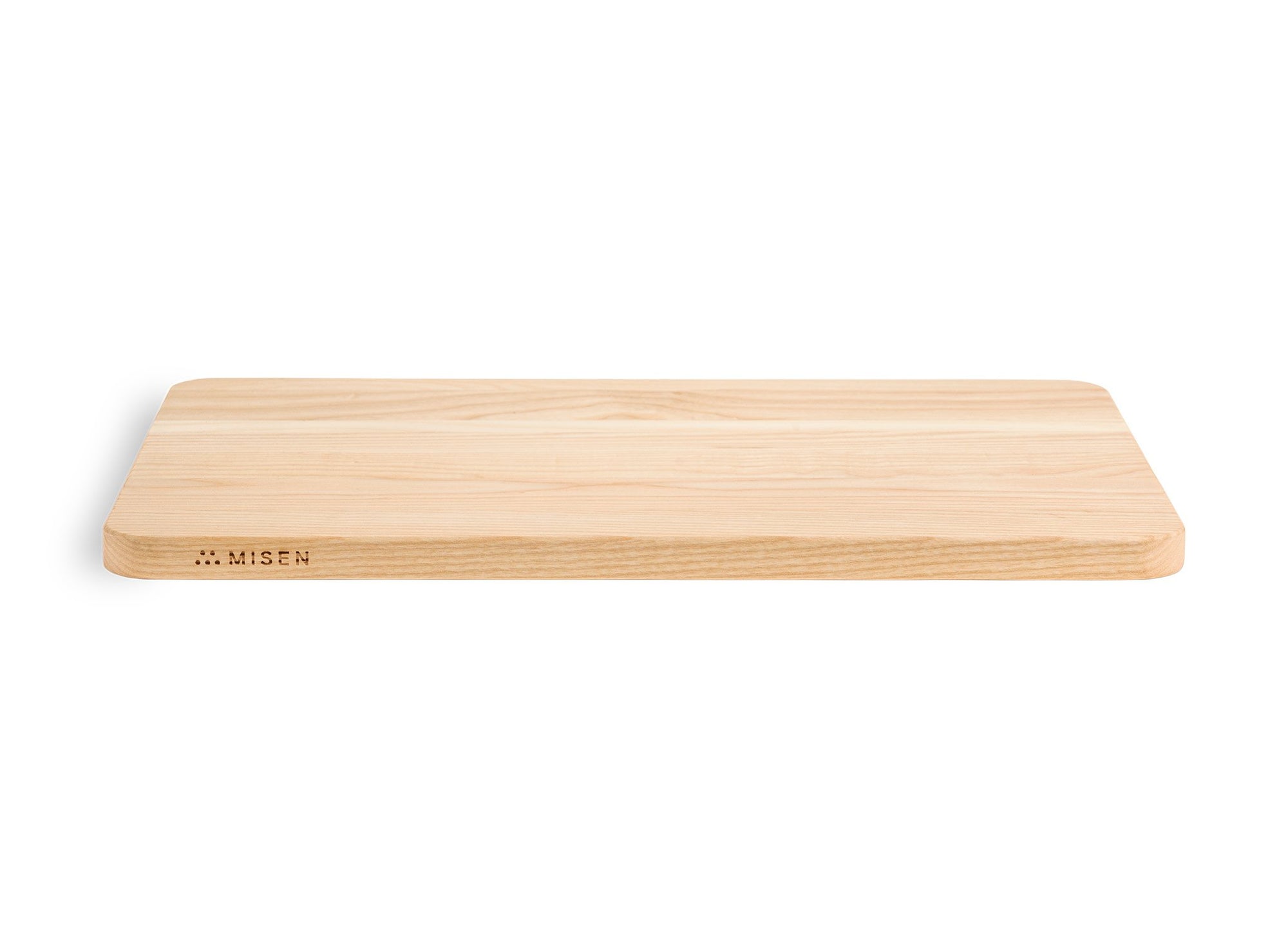 {{medium,2-piece-set}} A Medium Misen Wood Cutting Board seen from its longer side, with the Misen logo visible along its narrow edge.