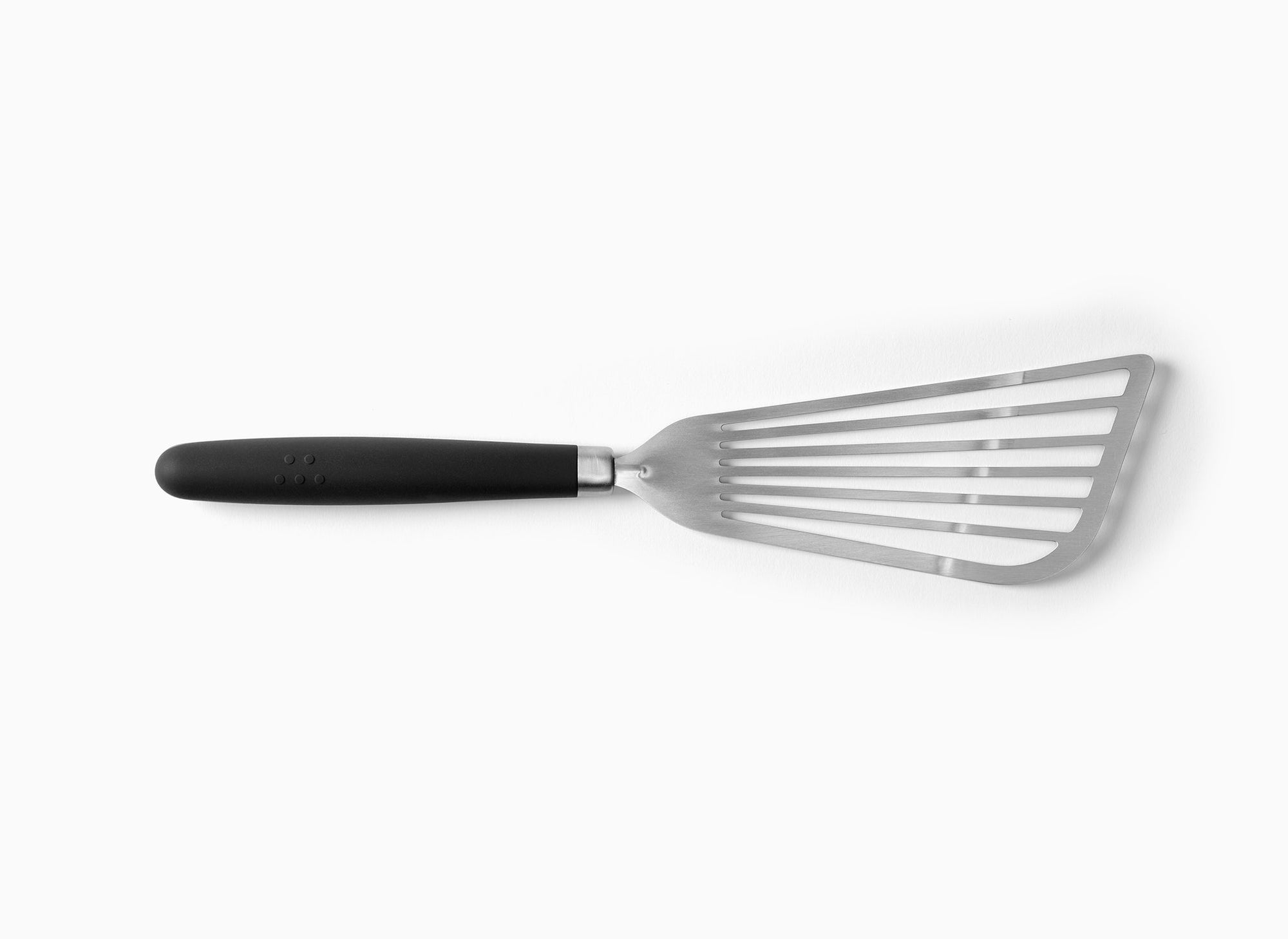 A Black Misen Metal Fish Spatula on a white background. Shows a slotted and flared metal head attached to a silicone handle.