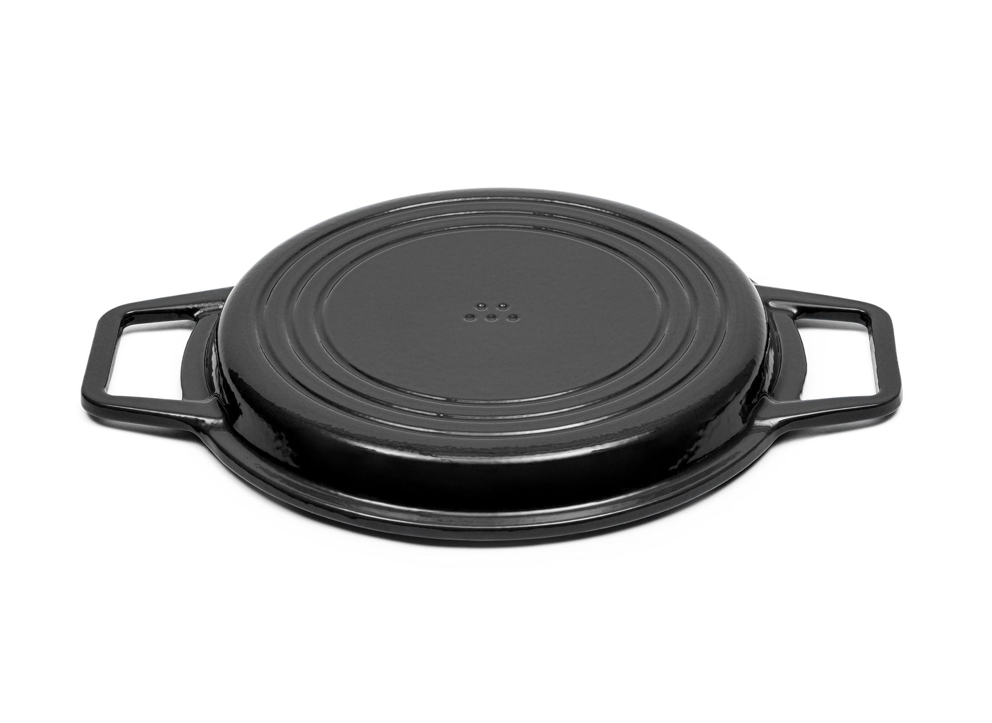 {{black,7-qt-black,9-qt-black}} A Black Misen Enameled Cast Iron Grill Pan face-down, showing a Misen logo on the base.