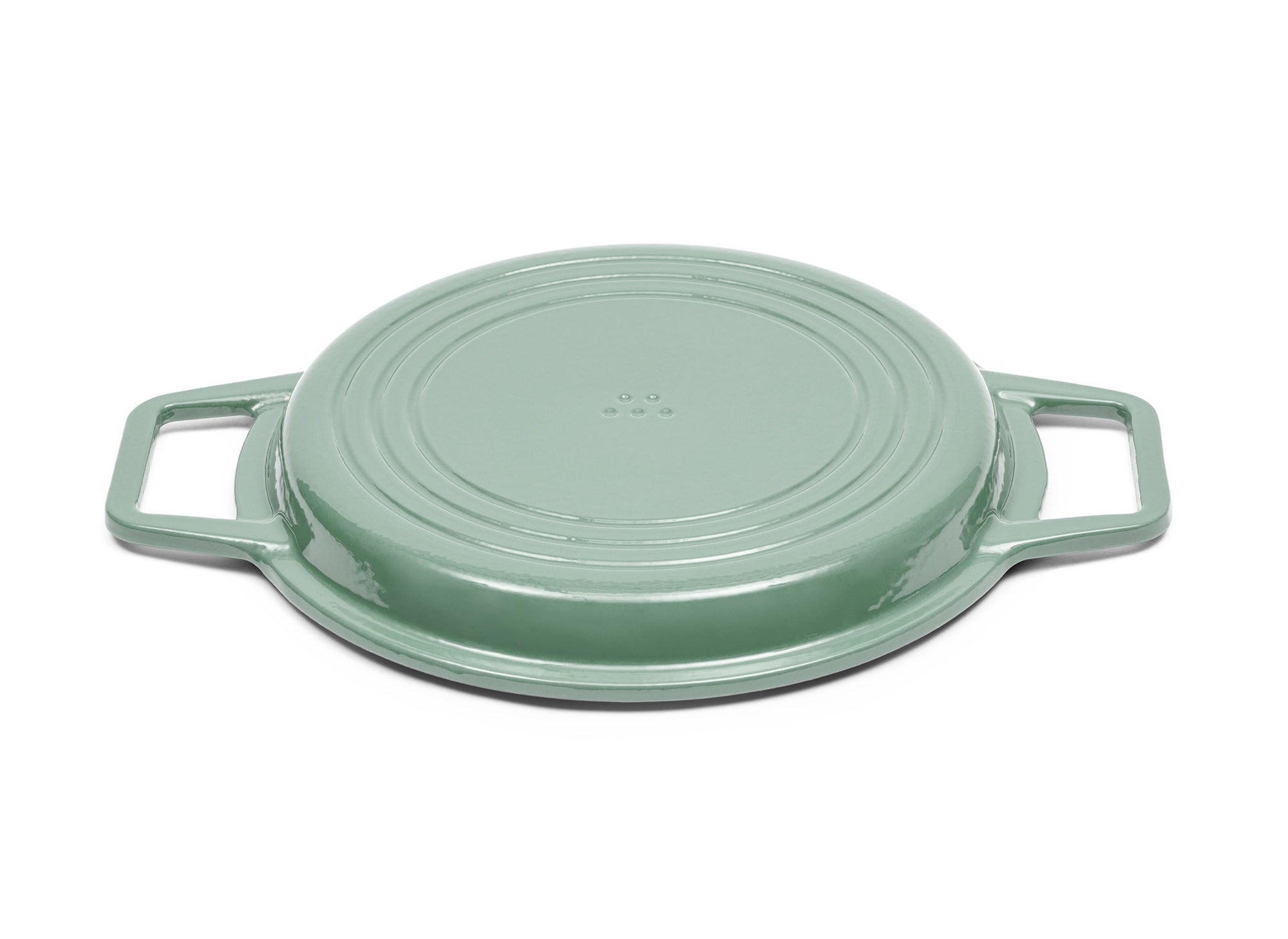 {{green,7-qt-green,9-qt-green}} A Green Misen Enameled Cast Iron Grill Pan face-down, showing a Misen logo on the base.