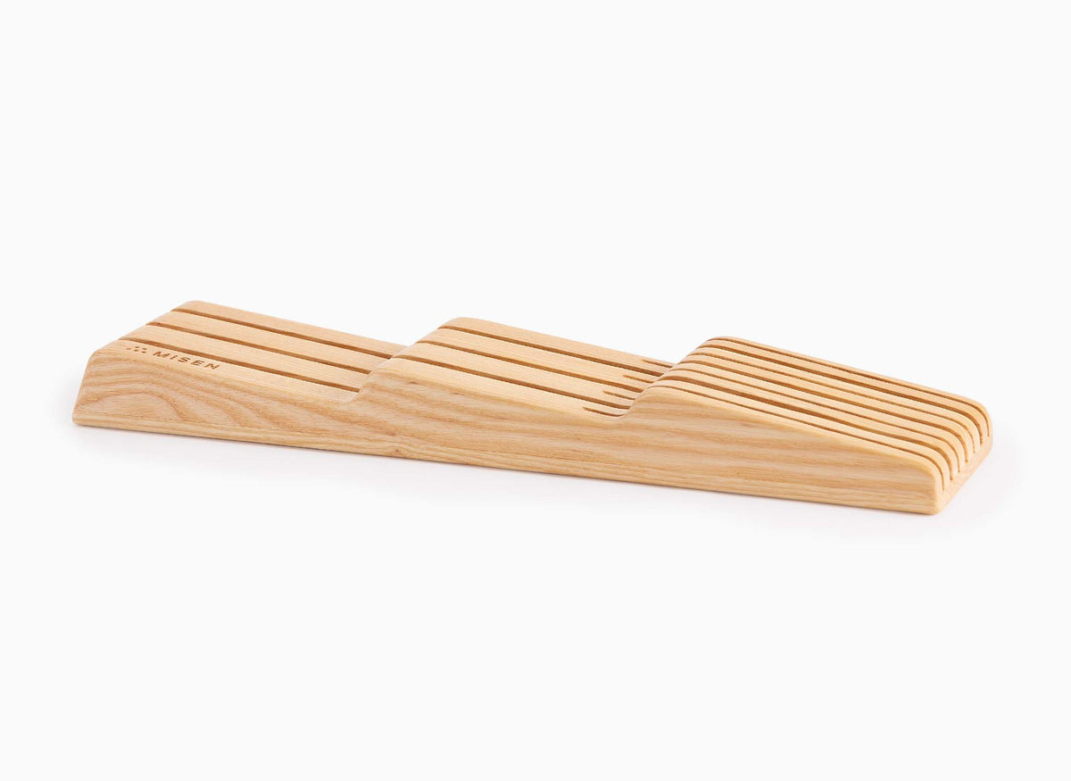 Empty Misen In-Drawer Knife Storage made from light Ash wood, seen from a slight angle.