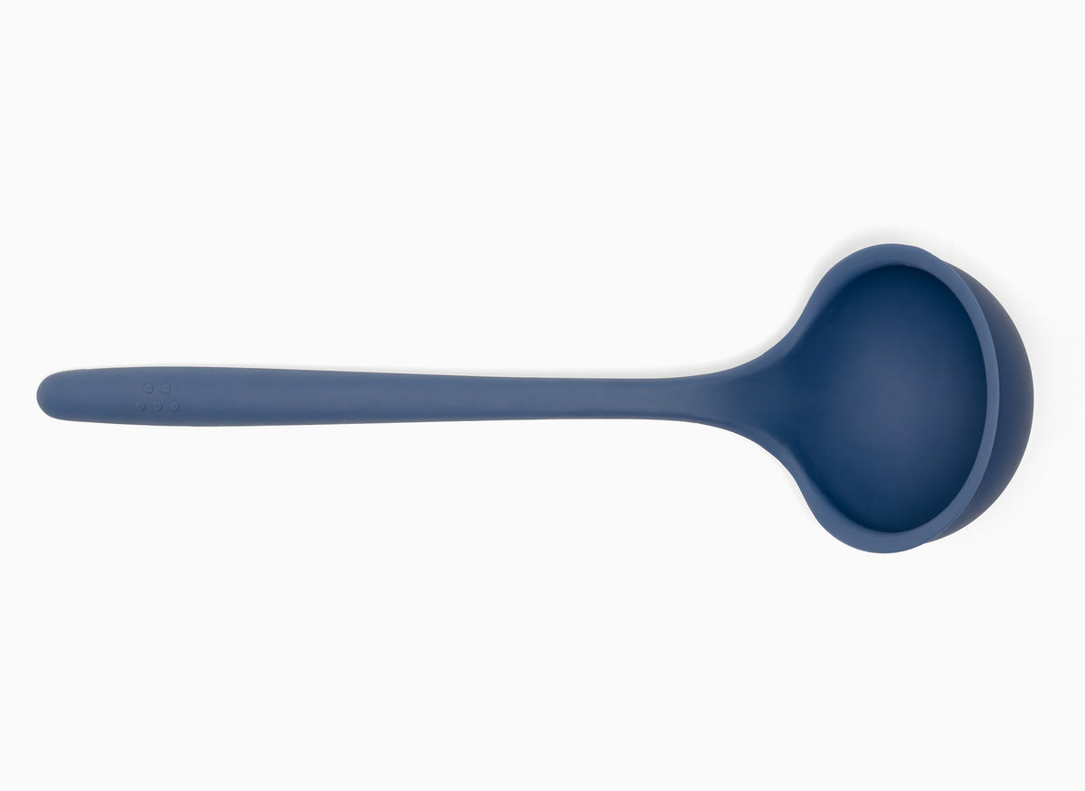 Blue Misen Ladle seen from above on a white background. A deep scoop head with a long silicone handle.