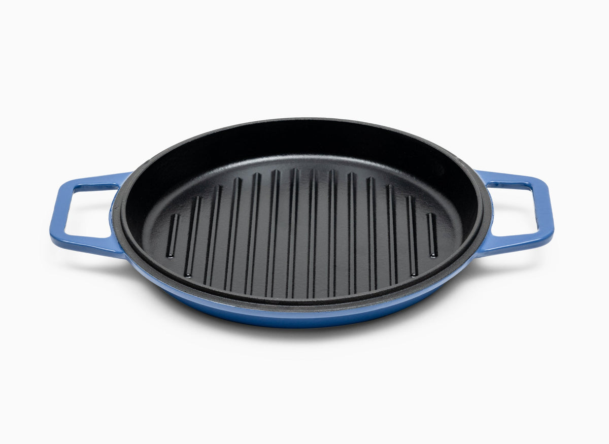 A Blue Misen Enameled Cast Iron Grill Pan face-up, showing a black cooking surface and raised grill ridges.