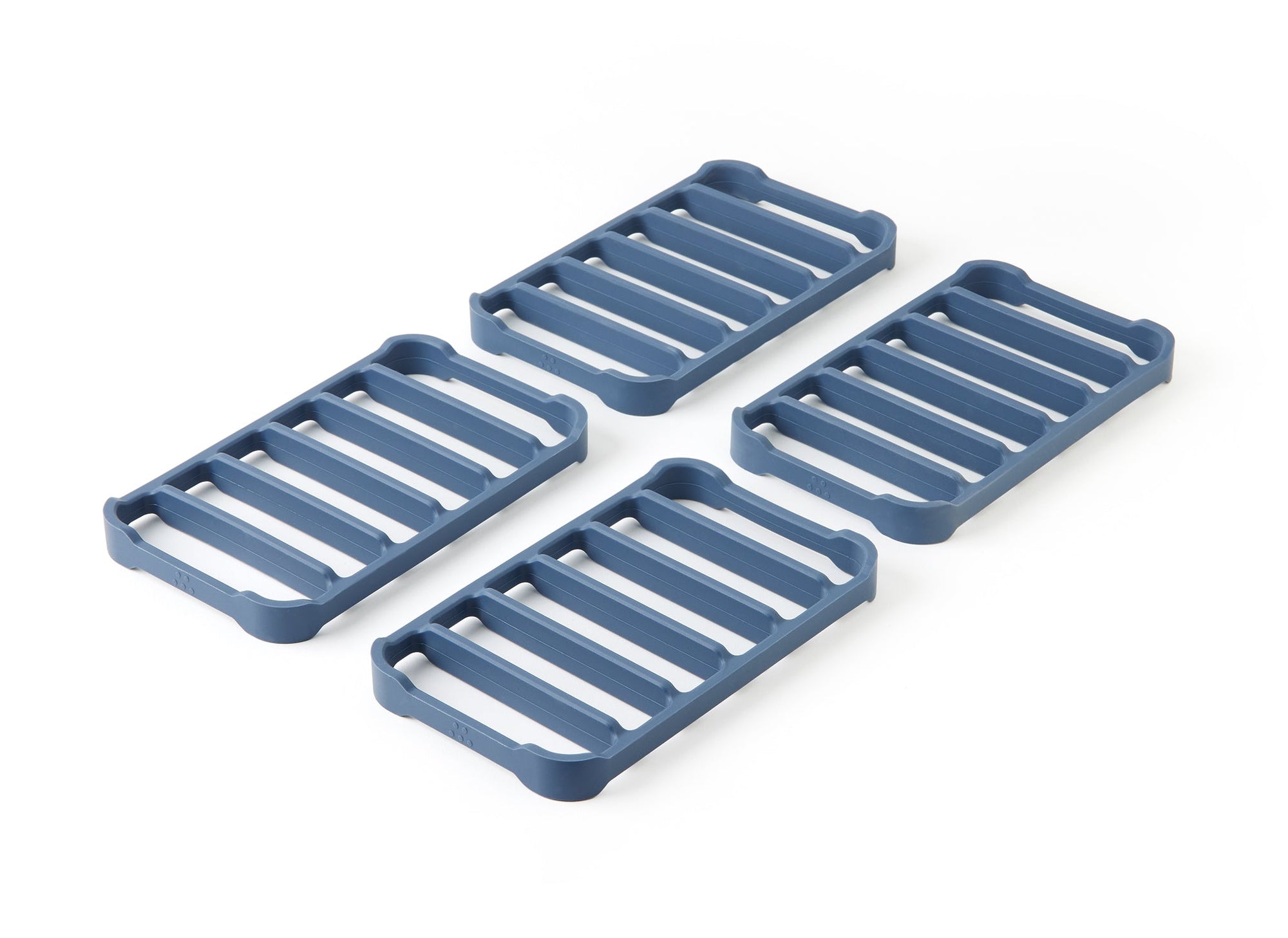 {{4-pack}} A top view of four blue Misen Silicone Roasting Racks at an angle, laying two-by-two. 