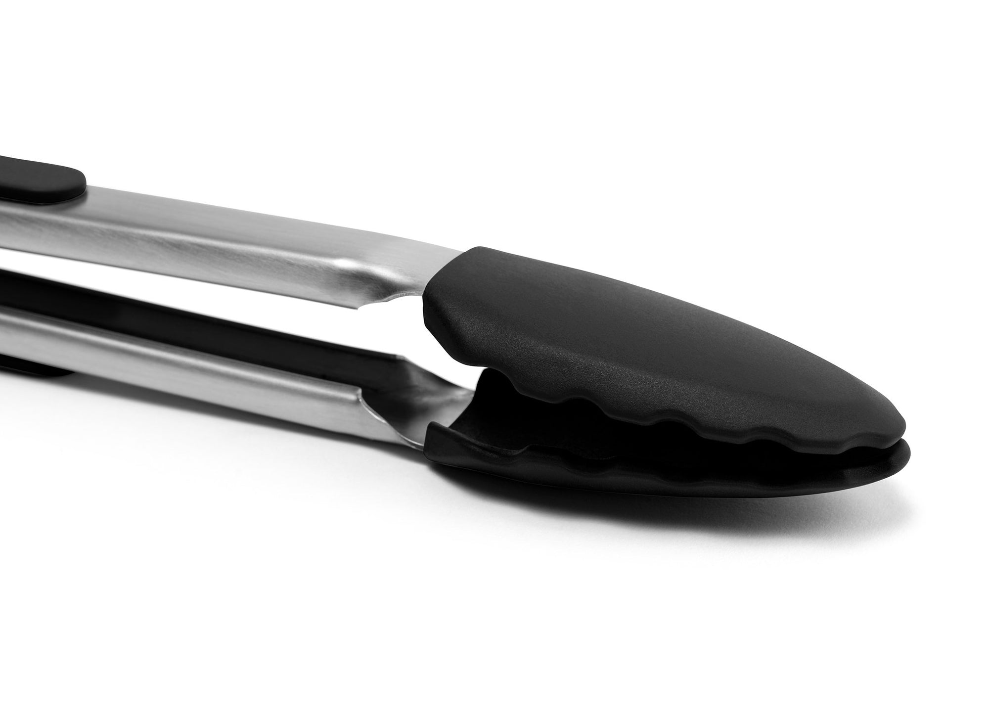 {{silicone-black}} Black Misen Silicone Tongs on a white background, showing black silicone-covered head with scalloped edges in a locked position.